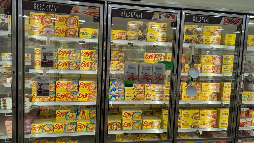 A wall of supermarket freezers filled with different boxes of Eggo waffles click for full resolution.
