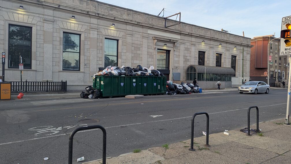 A giant dumpster from last year's DC33 trash strike. Somebody has put purple hearts on it. click for full resolution.