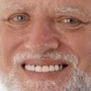 an emoji sized picture of the Hide the Pain Harold internet meme, which is a picture of an old man smiling a very fake smile in front of a laptop. The push to shove AI into everything makes me feel like Harold.