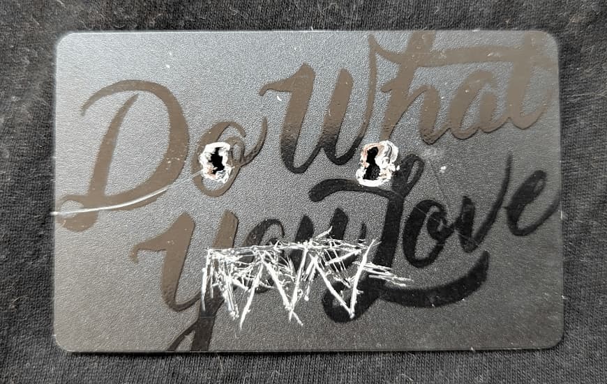 A black NFC badge card (used to get into a WeWork building) with the slogan 