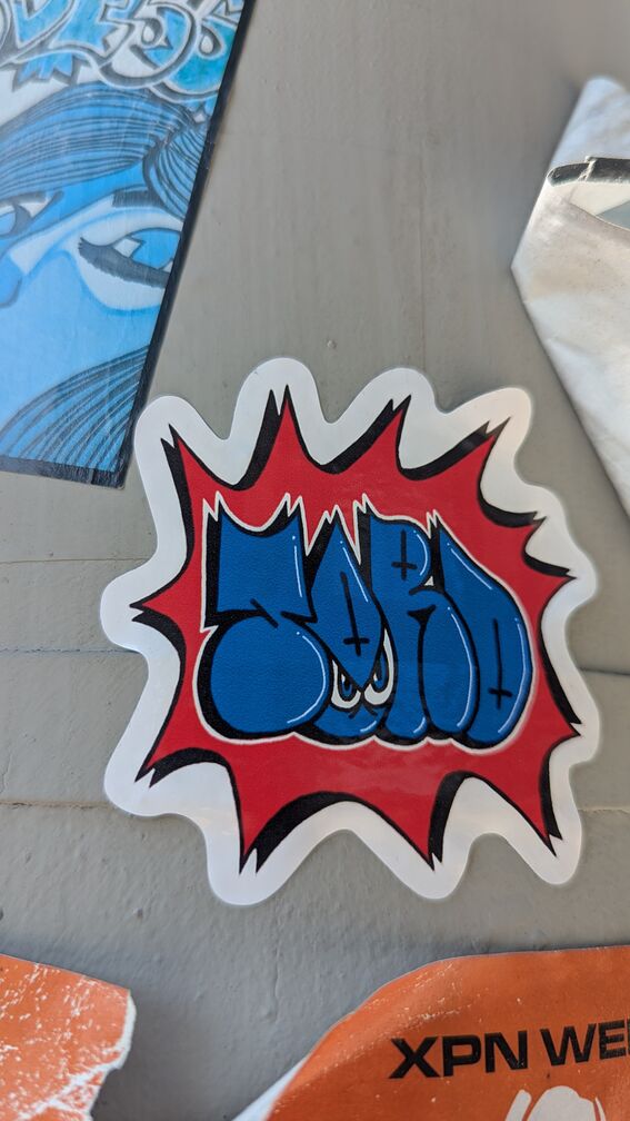 a grafitti slap sticker that might say 'Gard' click for full resolution.