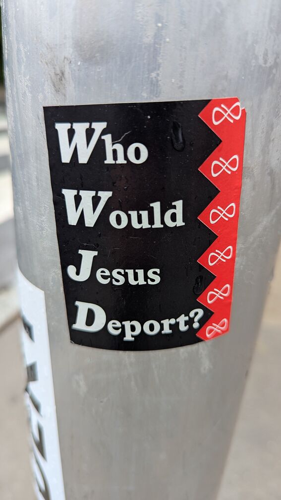 a sticker by curly that reads: Who Would Jesus Deport? click for full resolution.