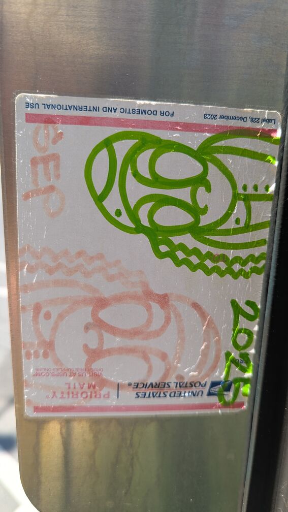 a green-and-red mirror image of the same graffiti doodle person click for full resolution.