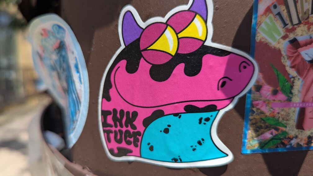 a psychadelic lizard dragon head thing, with the name ihktucf printed on it click for full resolution.