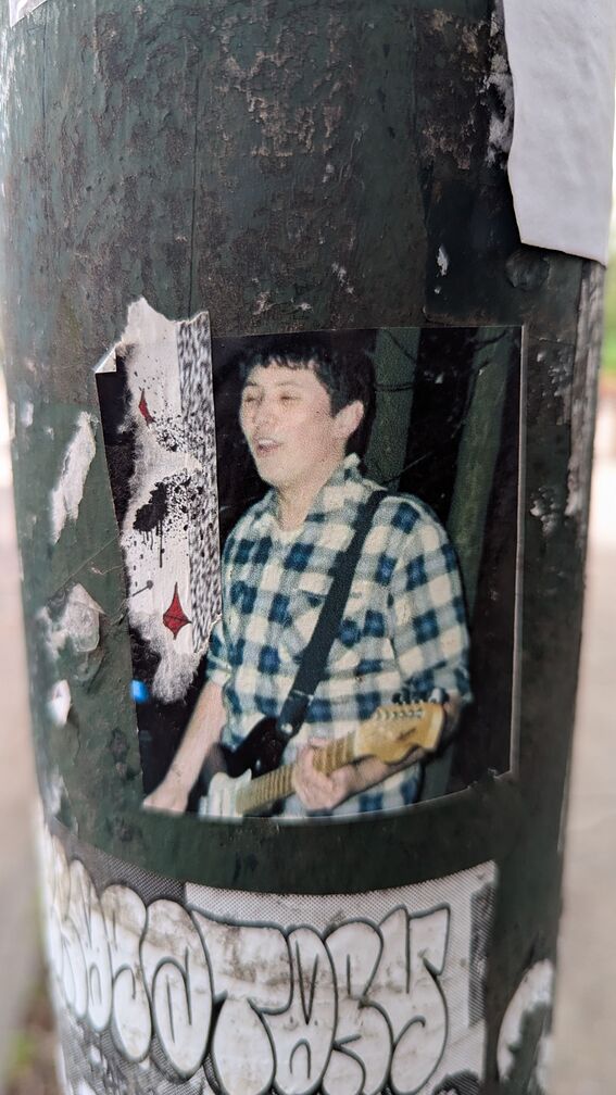 A photo of a guy playing an electric bass. click for full resolution.