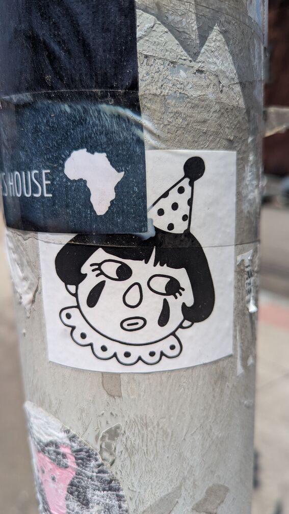 A black and white illustration of a clown woman glancing off to the side, with her lips pursed. click for full resolution.