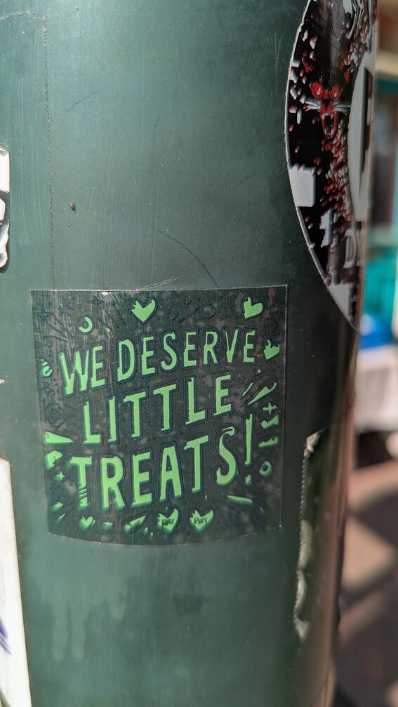 A sticker that says: We Deserve Little Treats! click for full resolution.