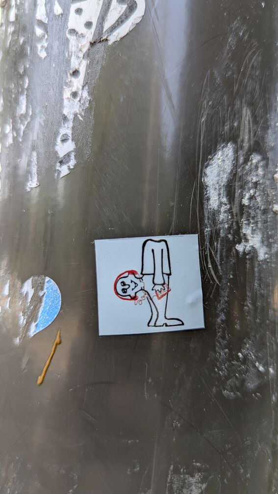 A drawing of a man with his head coming out of his butt. He's wearing headphones and listening to a walkman. click for full resolution.