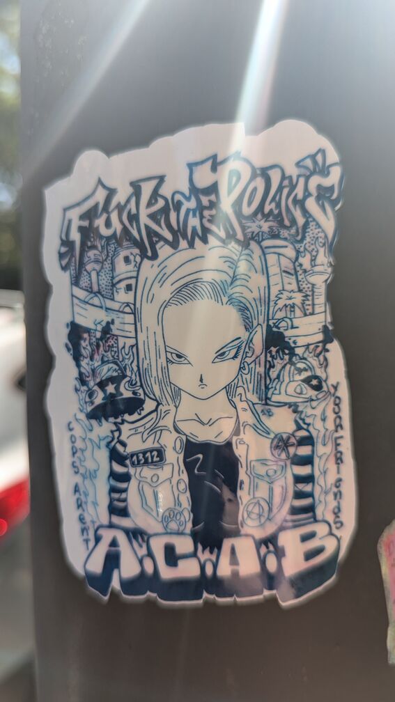 A drawing of Android 18 from Dragon Ball Z. Text around the sticker reads: Fuck the Police, ACAB. Cops aren't your friends. click for full resolution.