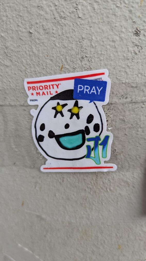 A creepy clown face with the word "Pray" coming out of a speech bubble. click for full resolution.