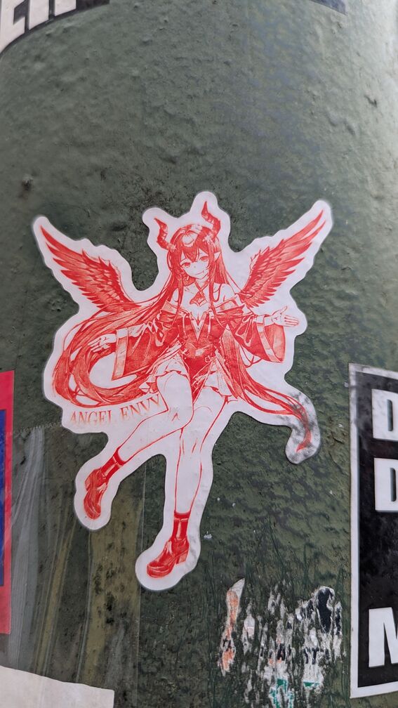 An anime angel girl with devil horns. Text reads: Angel Envy. click for full resolution.