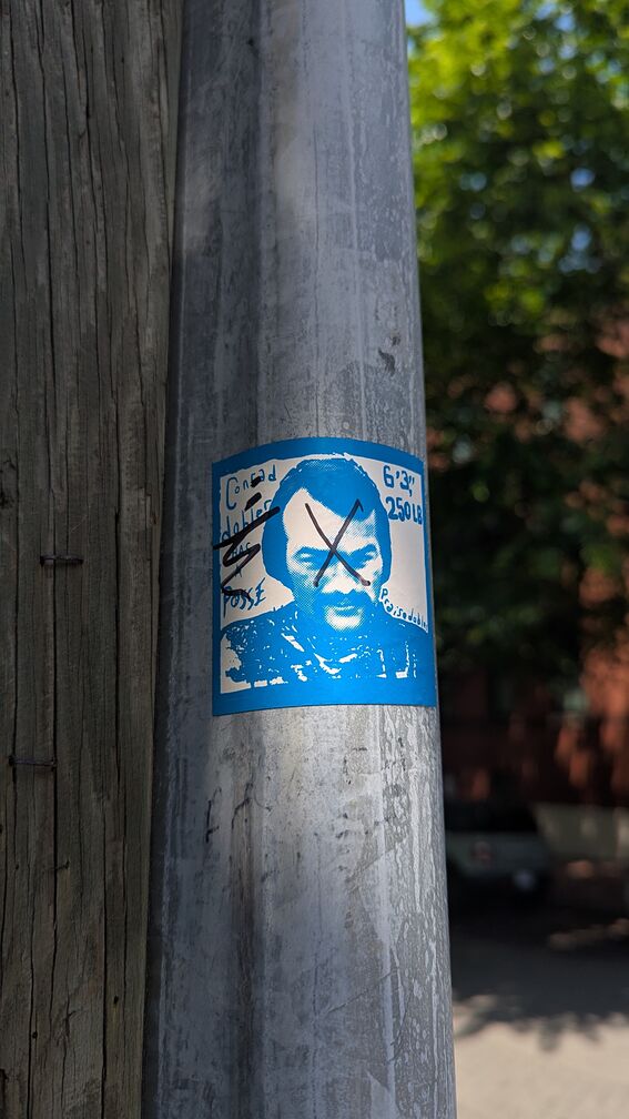 A dobler sticker that reads: Conrad dobler has a posse. But the text has been crossed over by a sharpie, and dobler's face x'd out! click for full resolution.