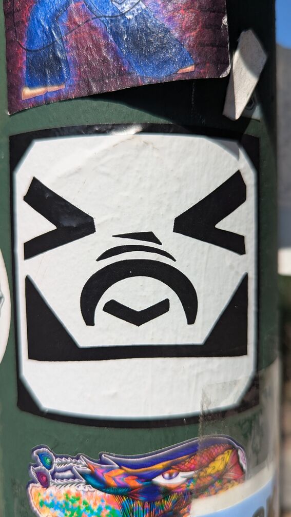 An illustration of a frowning emoji face, made mostly with large blocky lines like ascii text. click for full resolution.