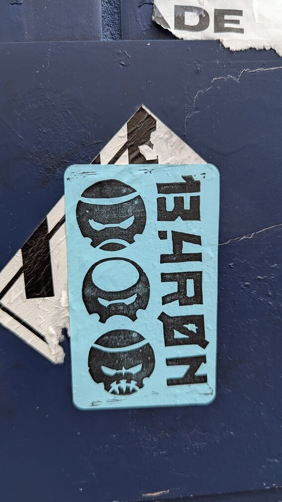 a sticker that reads 13.4ron. It has three sci-fi orb faces. click for full resolution.