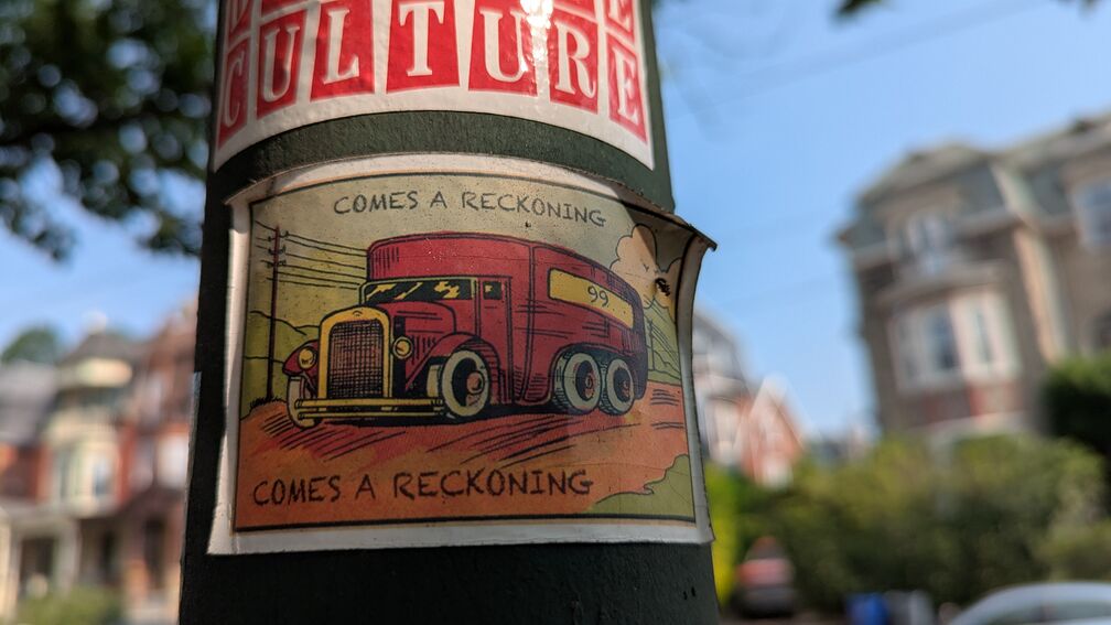 A sticker of an old timey truck and the text 'comes a reckoning' click for full resolution.