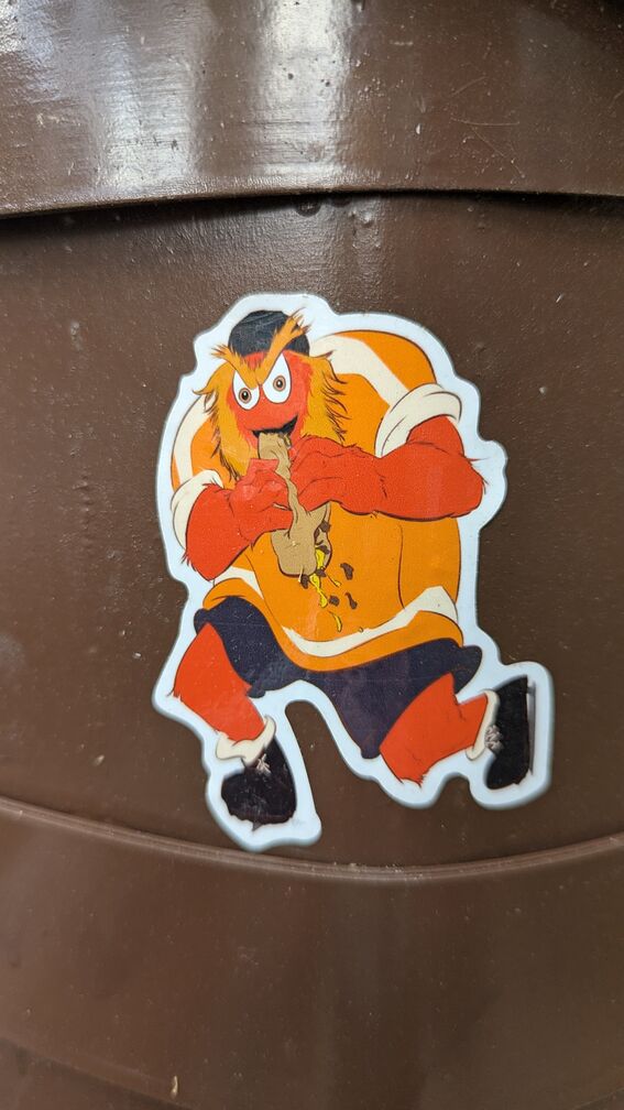 gritty wearing a hockey jersey, eating a grinder sandwich. Very Saturn Eating His Children vibes. click for full resolution.