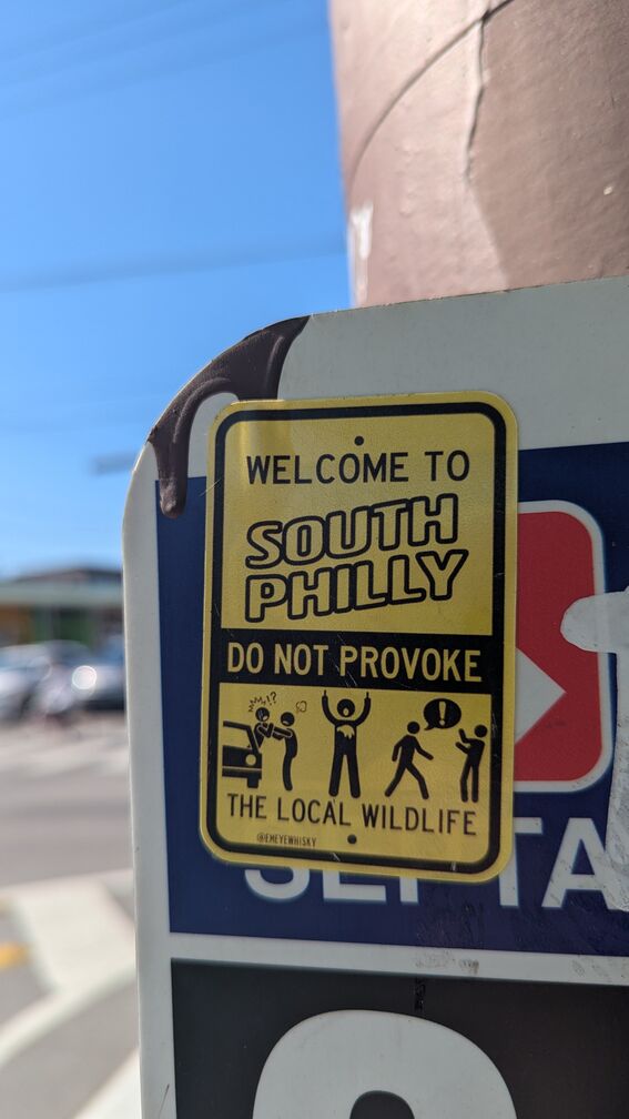 A sticker that reads: 'Welcome To South Philly. Do Not Provoke the Local Wildlife.' Then there's some graphics of angry looking stick figures. click for full resolution.